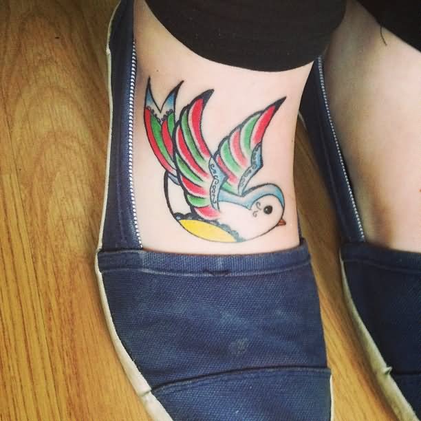 Colorful Flying Bird Tattoo On Right Foot