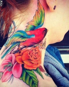 Colorful Flying Bird With Flowers Tattoo On Girl Side Neck