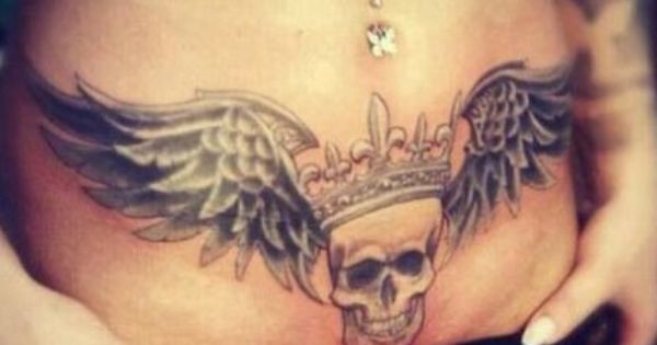 Crown On Skull With Wings Tattoo On Girl Stomach