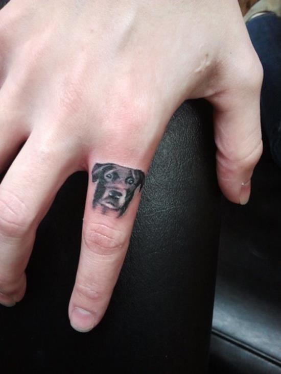Dog Face Tattoo On Finger