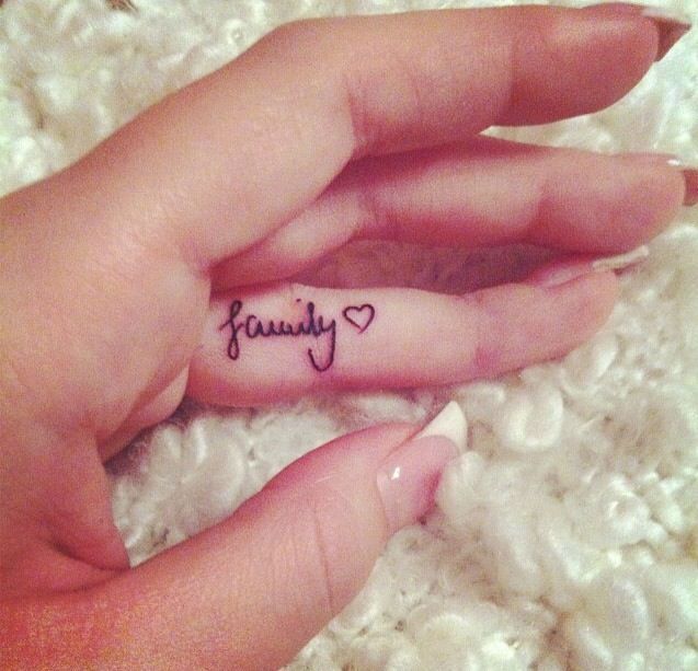 Family Lettering With Heart Tattoo On Girl Finger