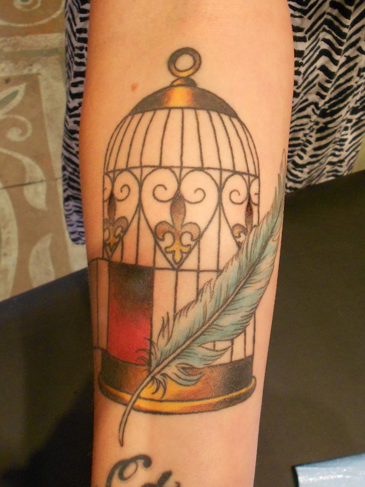 Feather And Cage Tattoo On Forearm