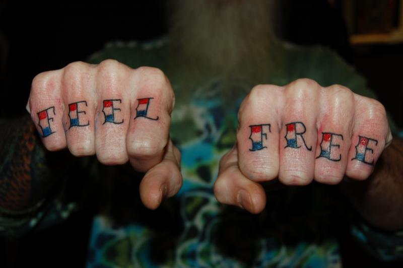 Feel Free Colorful Knuckle Tattoos On Hands