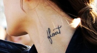 Flout Word Tattoo On Girl Side Neck