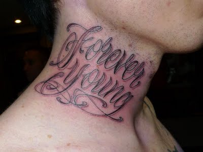 Forever Young Lettering Tattoo On Man Side Neck