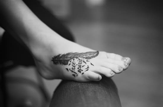 Free Spirit - Black And Grey Feather Tattoo On Right Foot