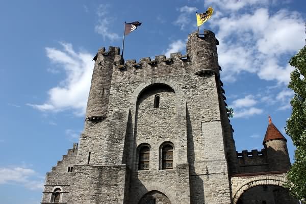 Front Gate Of Gravensteen Castle With Waving Flags On The Top