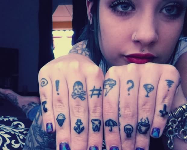 Girl Showing Her Knuckle Tattoo