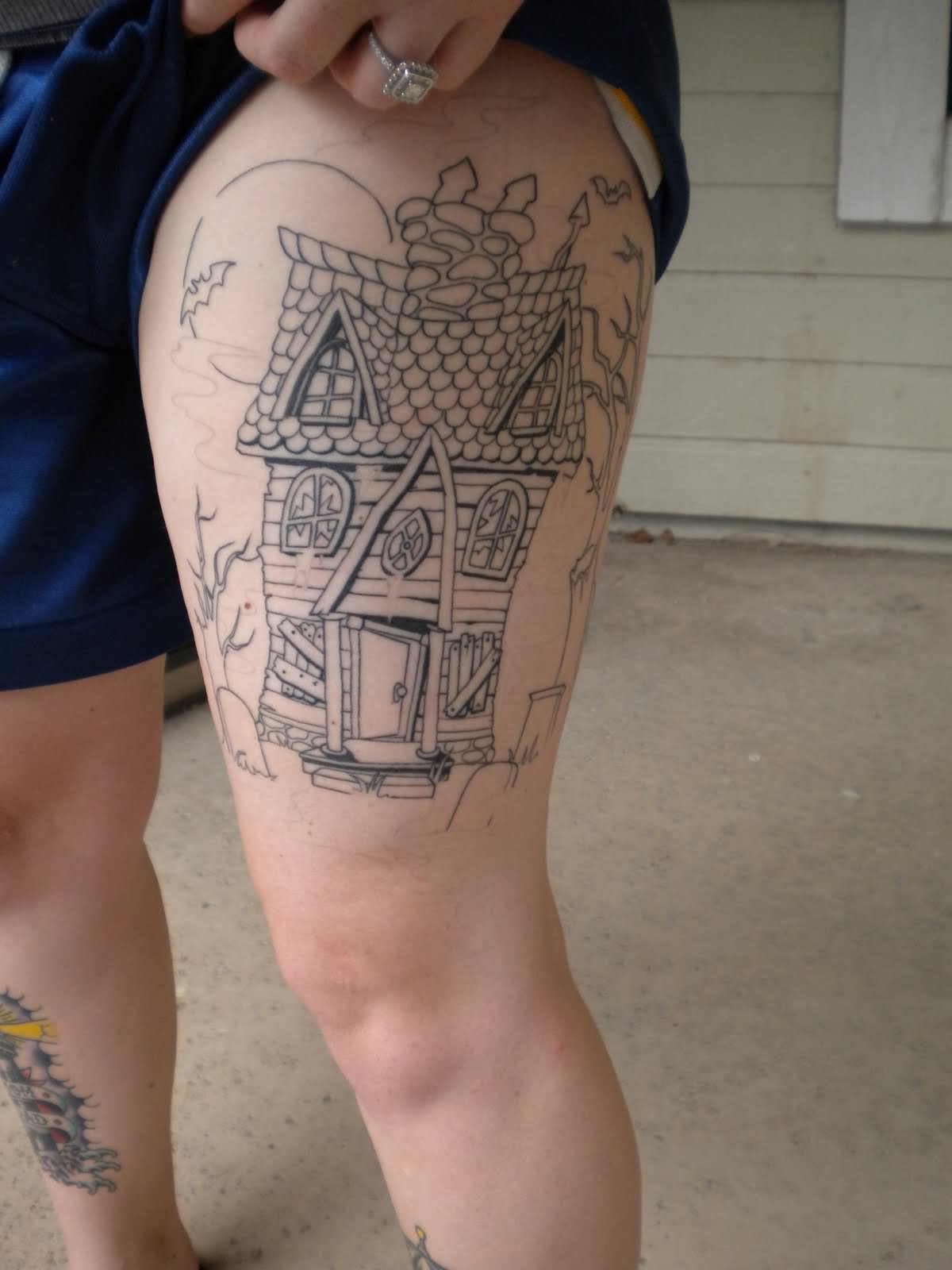 Girl Side Thigh Haunted House Tattoo