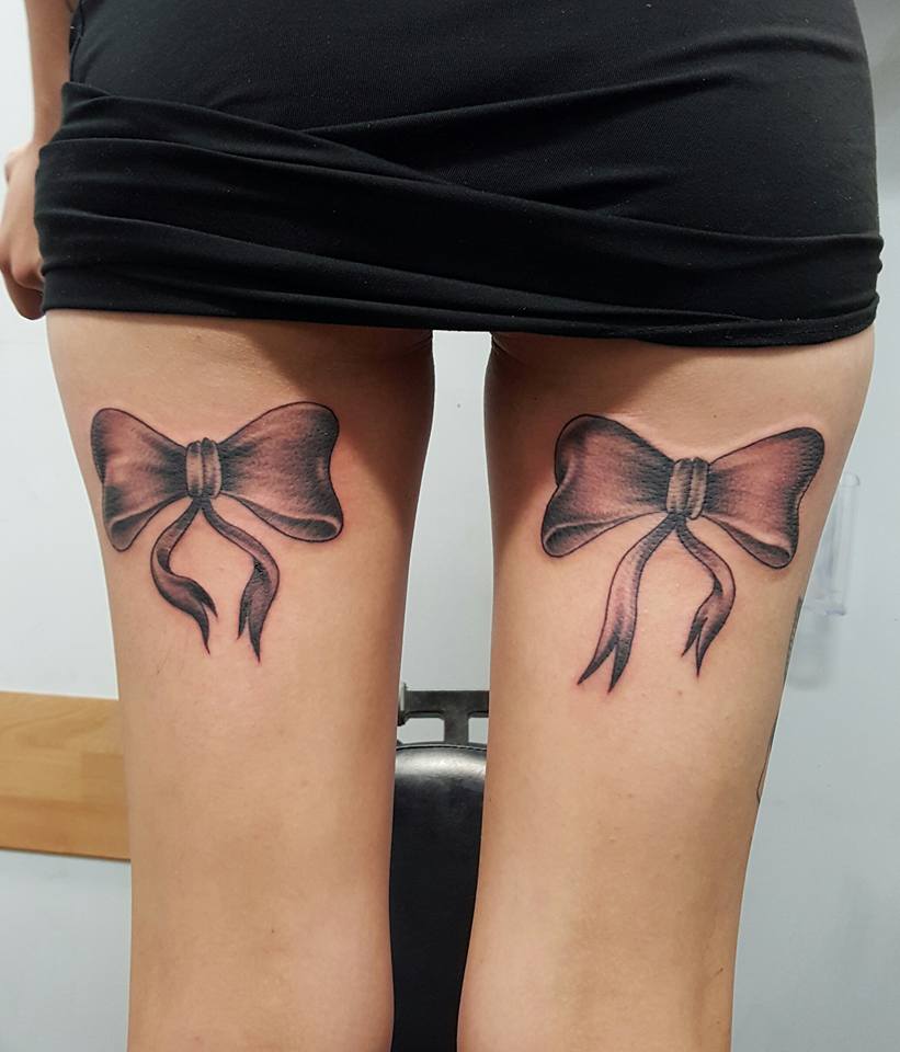 Grey Ink Bow Tattoos On Back Thigh by Jamie