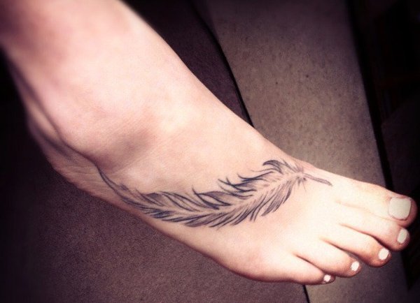 Grey Ink Feather Tattoo On Girl Right Foot