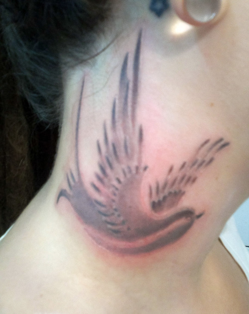 Grey Ink Flying Bird Tattoo On Side Neck