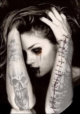 Grey Ink Gothic Skull Tattoo On Girl Right Forearm