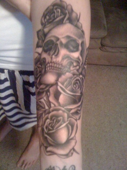 Grey Ink Gothic Skull With Roses Tattoo On Arm