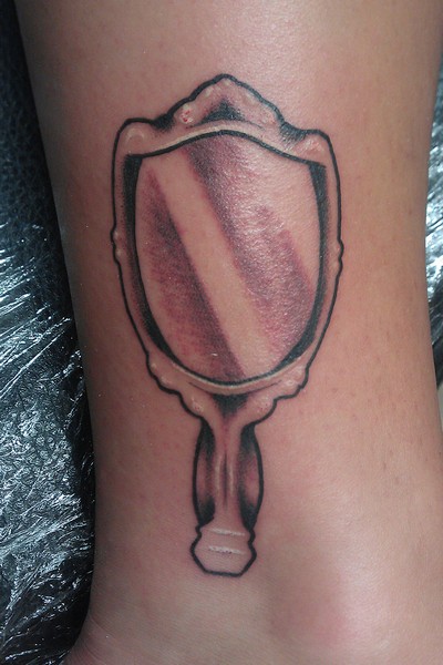 Grey Ink Hand Mirror Tattoo On Leg