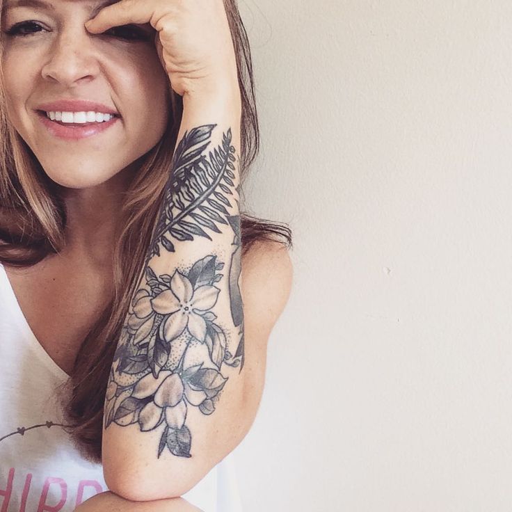 Grey Ink Nature Flowers Tattoo On Girl Left Arm
