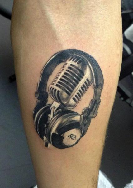 Grey Ink Realistic Microphone And Headphone Tattoo On Arm