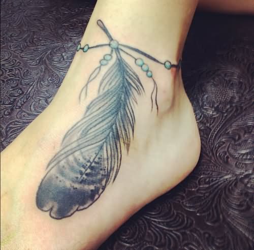 Grey Ink Rosary Feather Tattoo On Ankle
