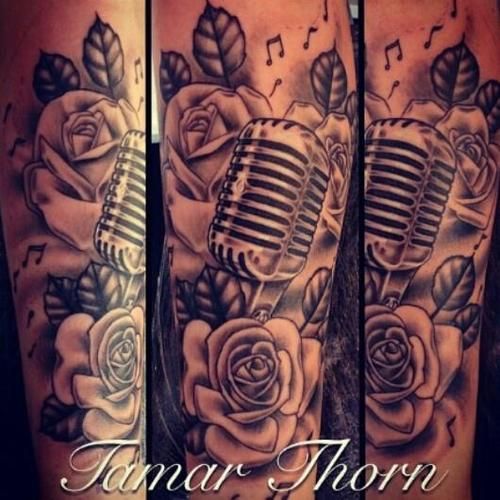 Grey Ink Rose And Microphone Tattoo On Sleeve
