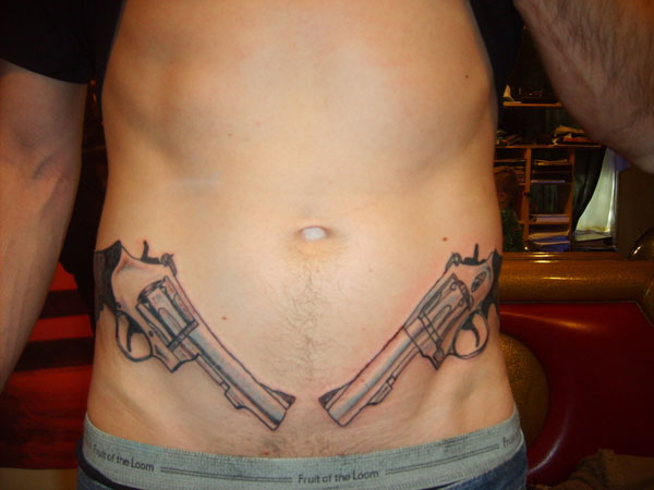 Grey Ink Two Guns Tattoo On Man Stomach