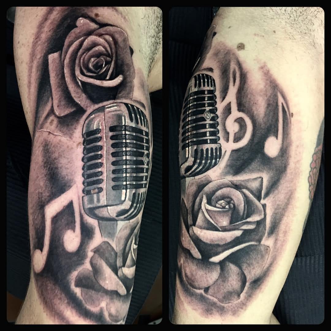 Grey Rose Flower And Microphone Tattoo On Sleeve