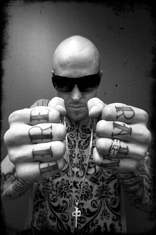 Guy Showing His Knuckle Tattoos