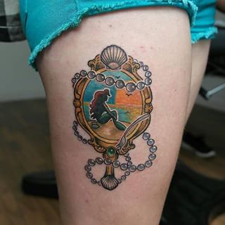 Hand Mirror Tattoo On Right Thigh