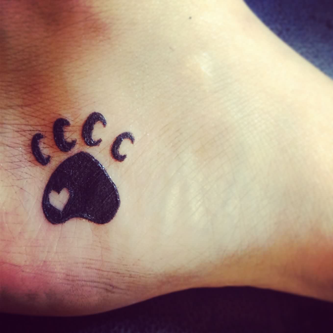 Heart In Paw Print Tattoo On Inner Ankle