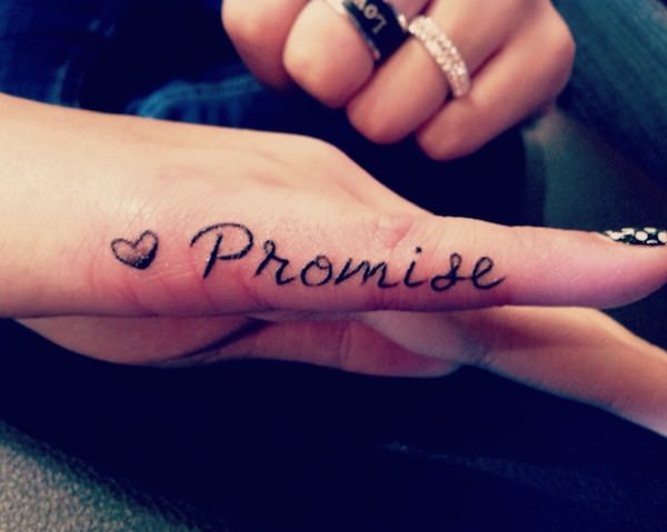 Heart With Promise Lettering Tattoo On Girl Finger