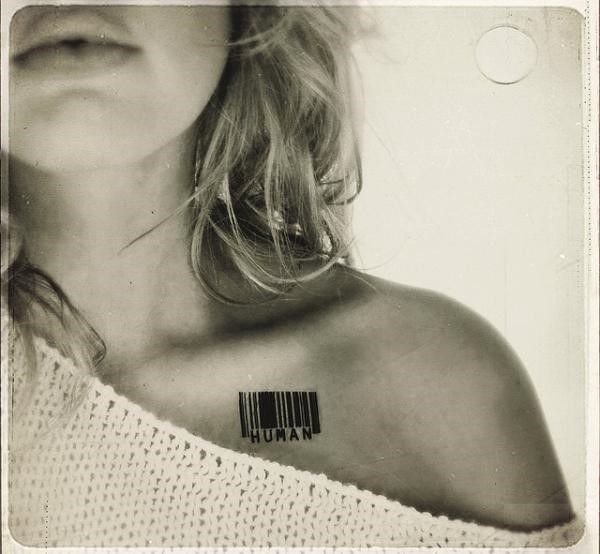 Human – Barcode Tattoo On Girl Collarbone By Gilda