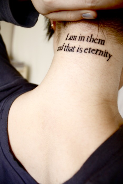 I Am In Them And That Is Eternity Words Tattoo On Girl Back Neck
