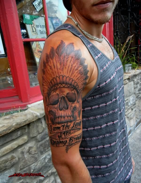 Indian Chied Skull Head With Banner Tattoo On Man Right Half Sleeve By Jake S. Eaves