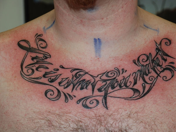 Life Is What You Make It Lettering Tattoo On Man Collar Bone