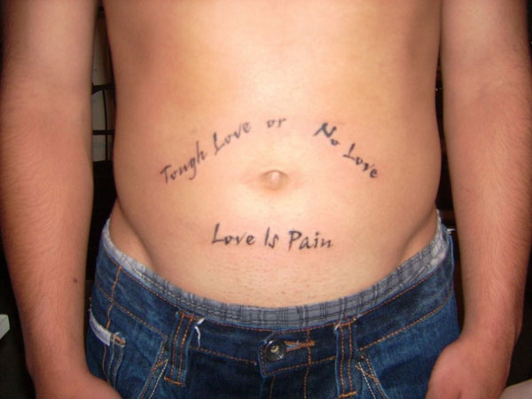 Love Is Pain Lettering Tattoo On Man Stomach