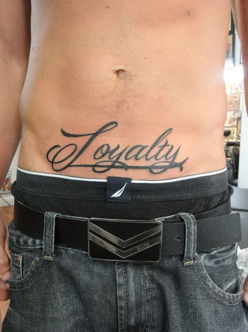 Loyalty Lettering Tattoo On Man Stomach