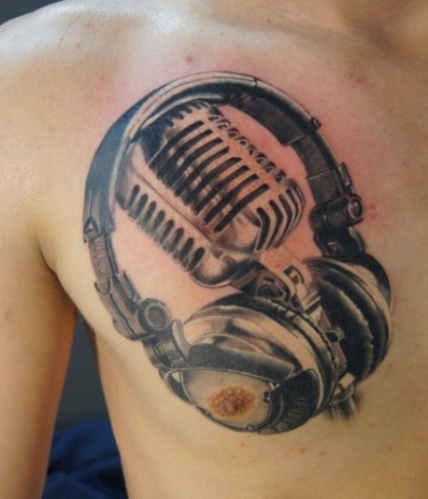 Man Chest Grey Ink Microphone And Headphone Tattoo