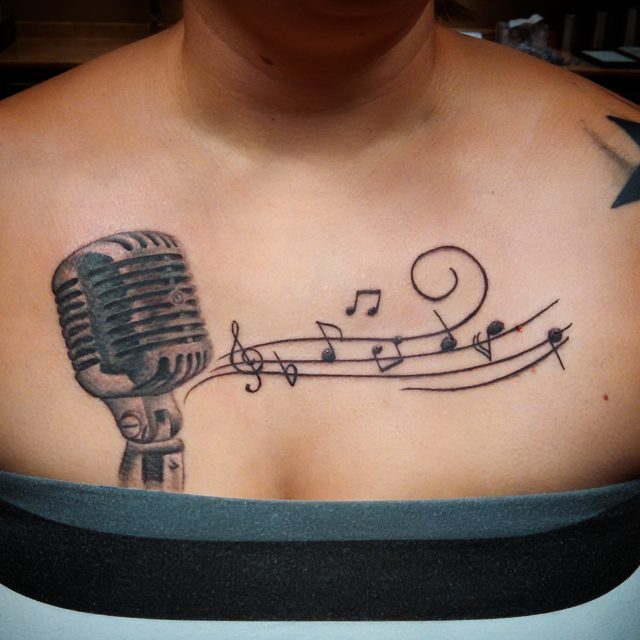 Mic And Music Notes Tattoo On Chest