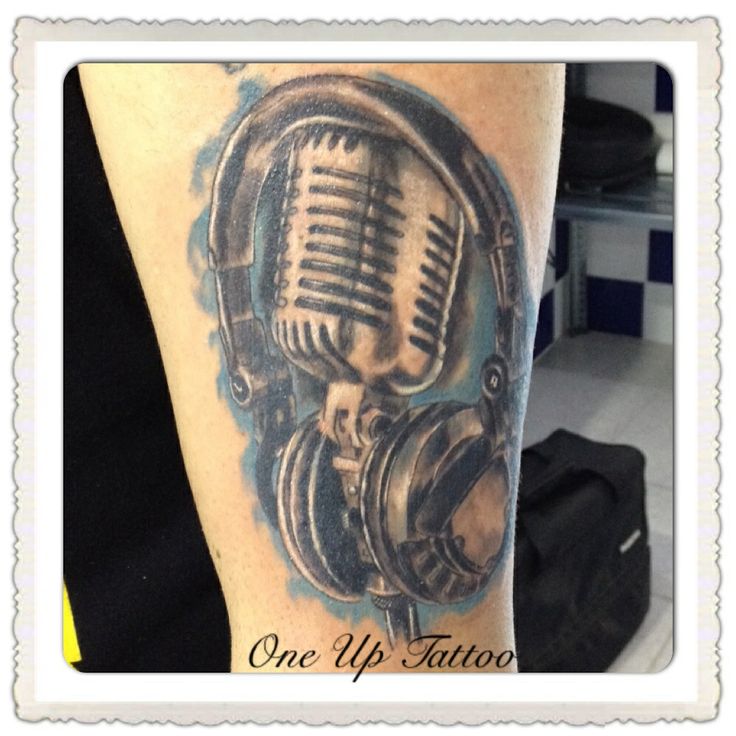 Microphone And Headphone Tattoo On Left Sleeve