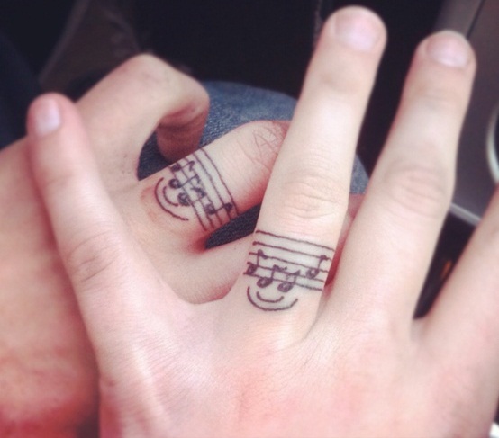 Music Knot Ring Tattoo On Couple Finger
