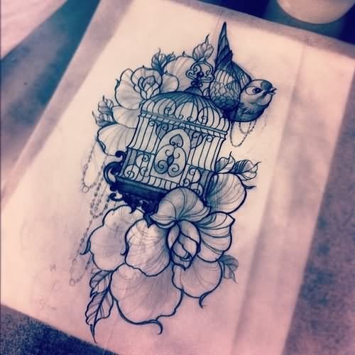 Nice Flowers And Cage With Bird Tattoo Design