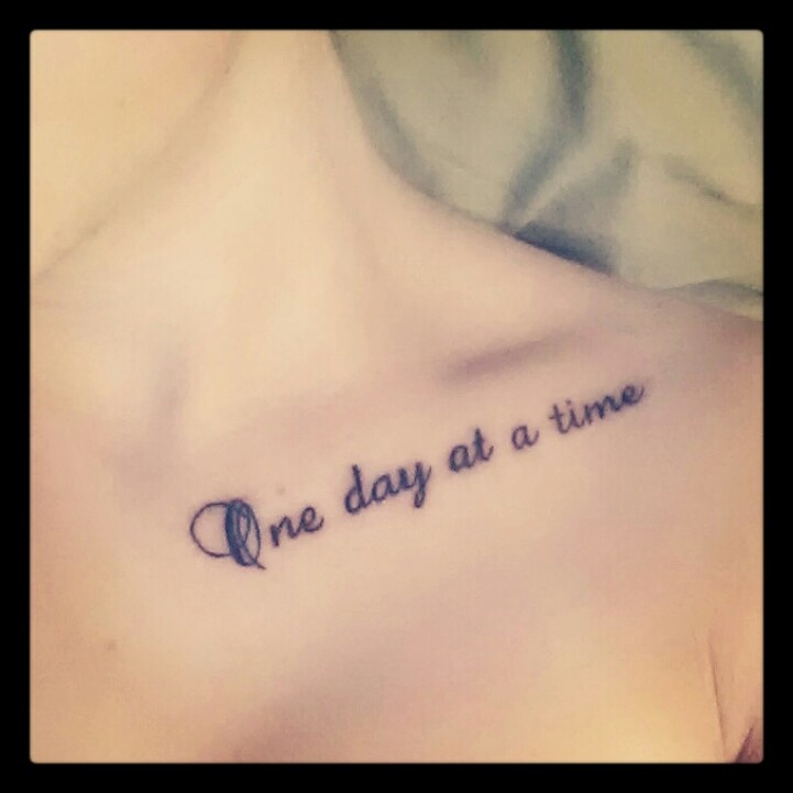One Day At A Time Lettering Tattoo On Girl Collar Bone