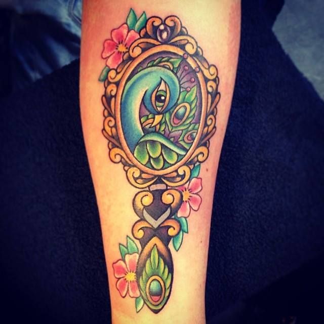 Peacock In Hand Mirror Tattoo On Forearm