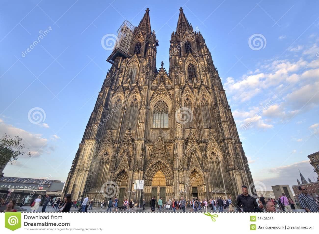 People Walk Beneath Cologne Cathedral During Sunset Picture