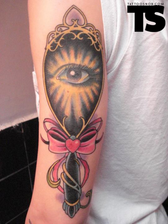 Pink Ribbon Bow Eye Hand Mirror Tattoo On Right Sleeve