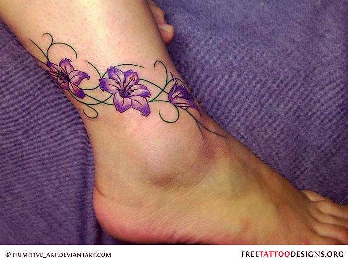 Purple Ink Flowers Tattoo On Ankle