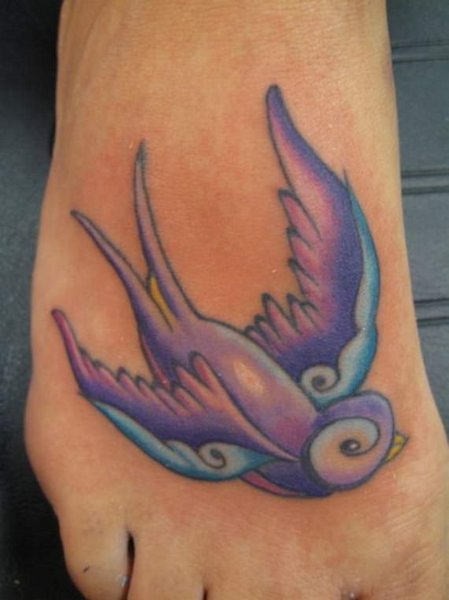 Purple Ink Flying Bird Tattoo Design For Foot