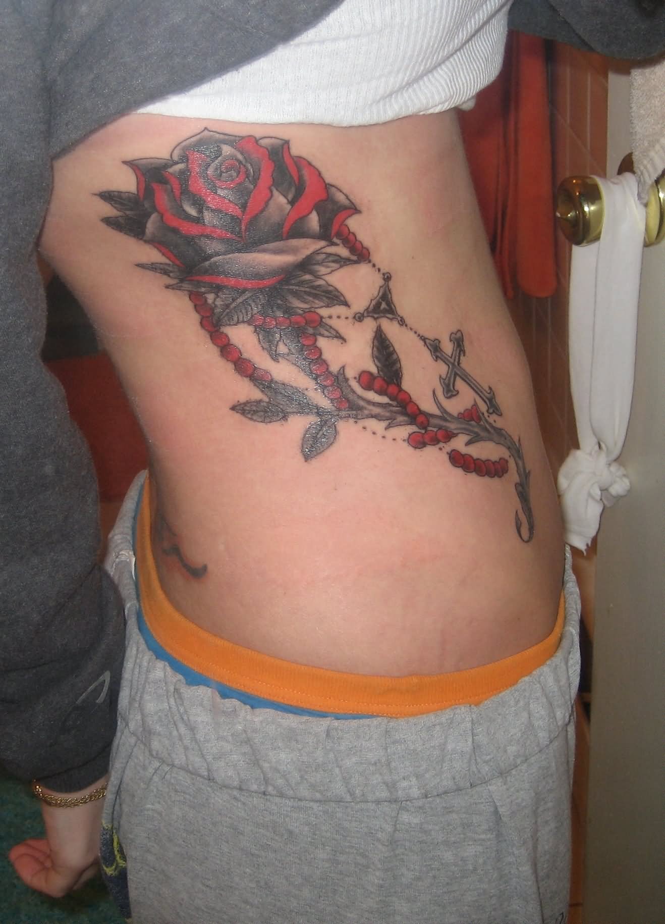 Red And Black Gothic Rose With Rosary Cross Tattoo On Right Side Rib