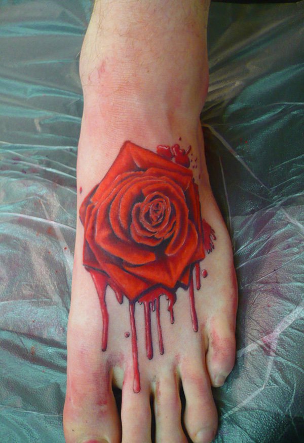 Red Ink Rose Tattoo On Left Foot
