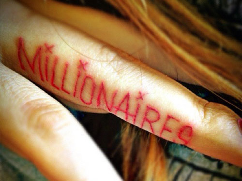 Red Millionaires Lettering Tattoo On Side Finger