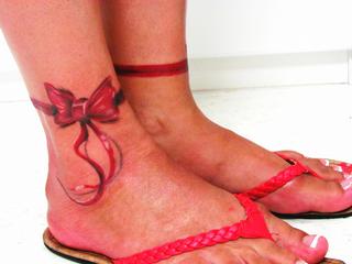 Ribbon Bow Tattoo On Right Ankle